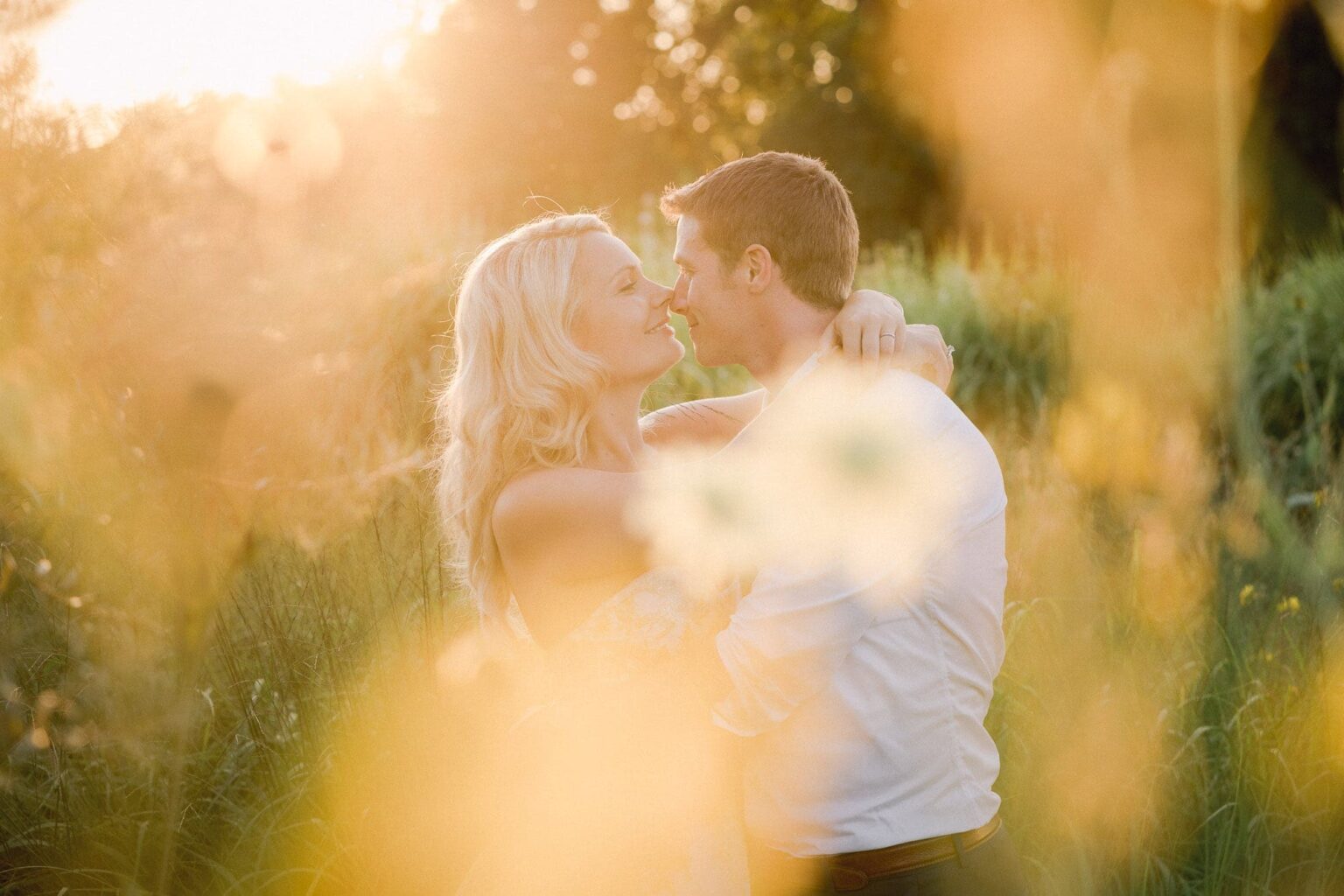 Bride and groom kiss on their wedding day in the New Forest.