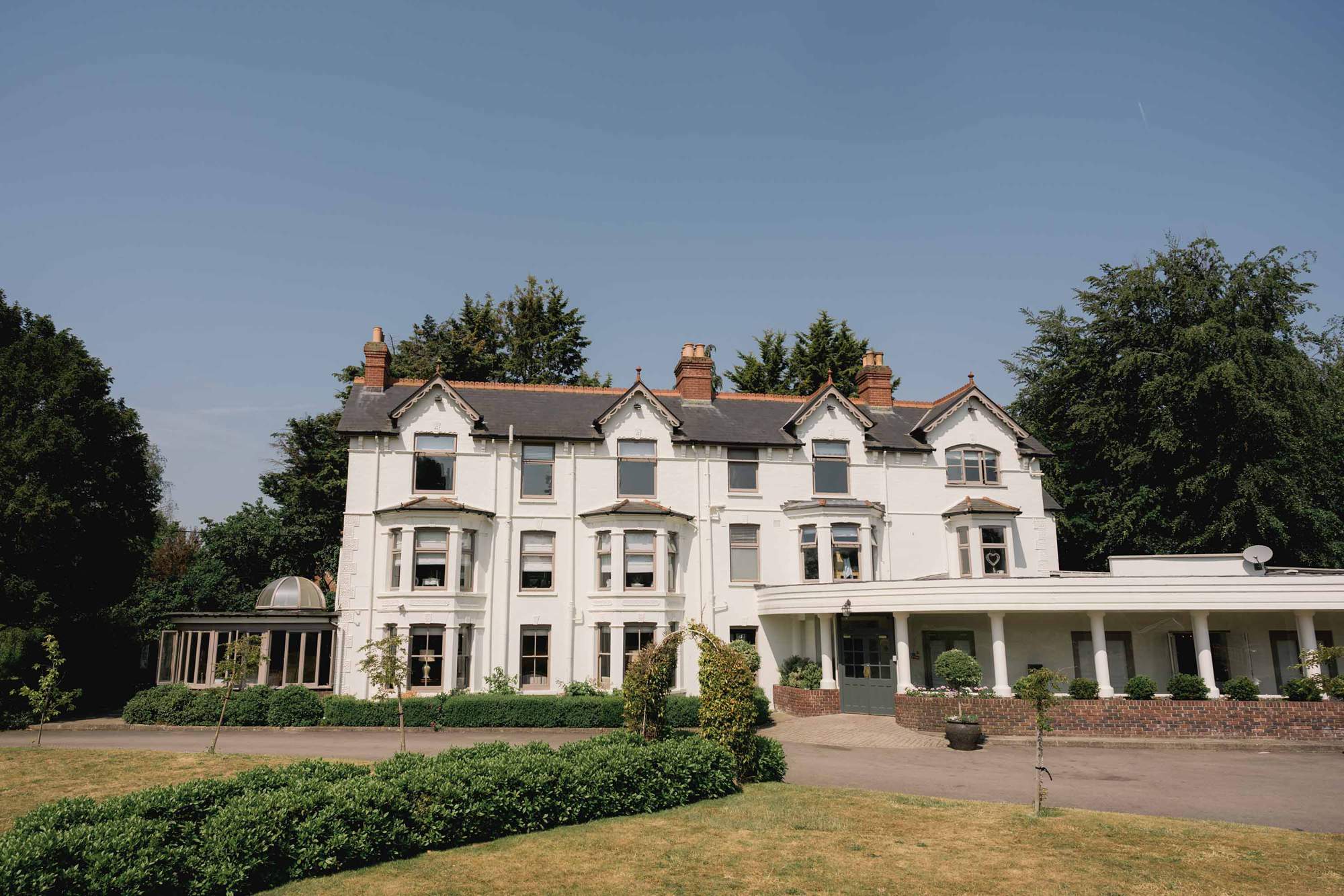 Southdowns Manor wedding venue on a beautiful Summers day with deep blue sky.