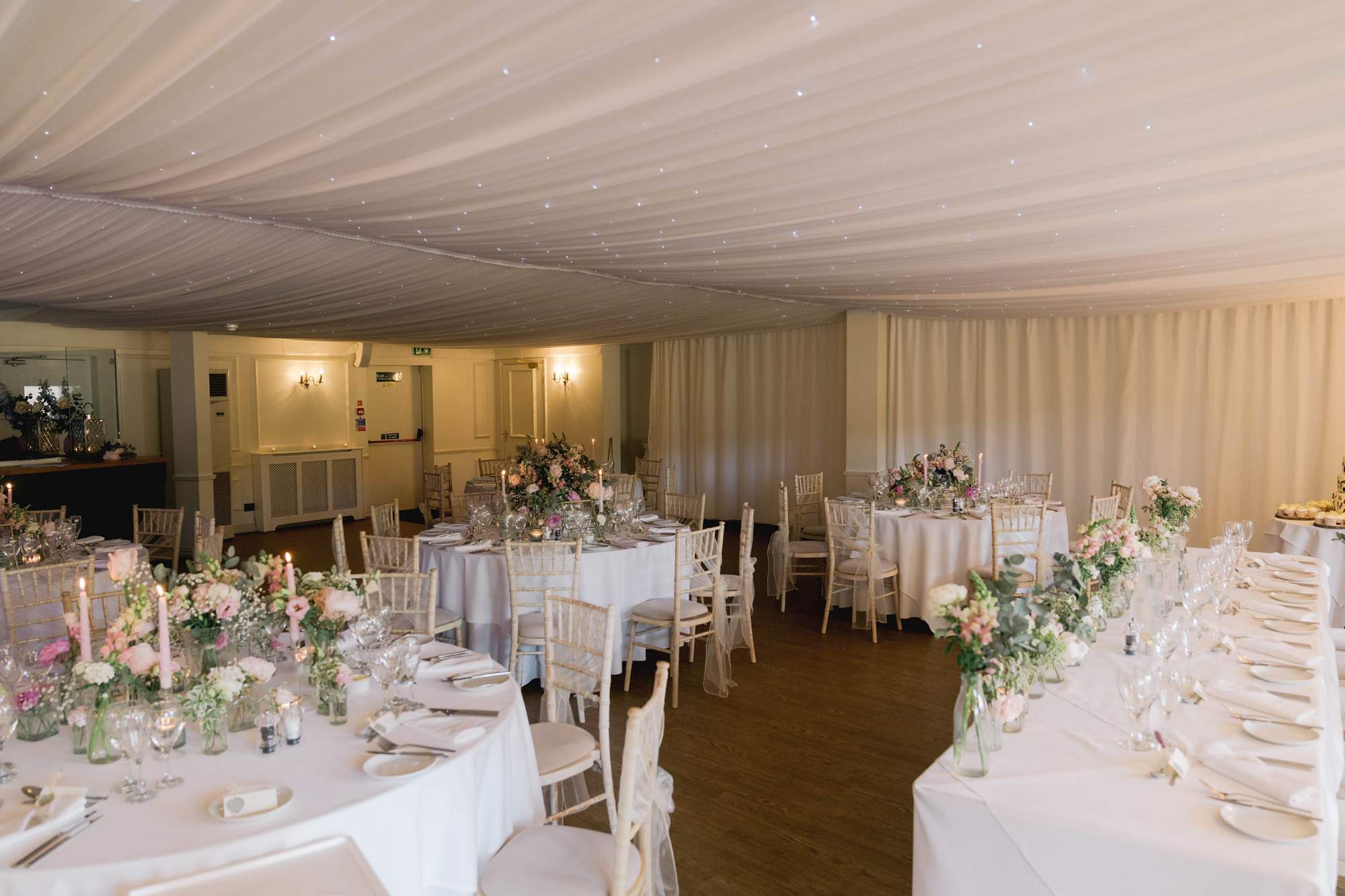 Wedding reception room all laid out at Southdowns Manor.